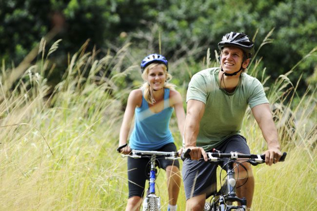Active couple biking in Highlands Ranch Colorado