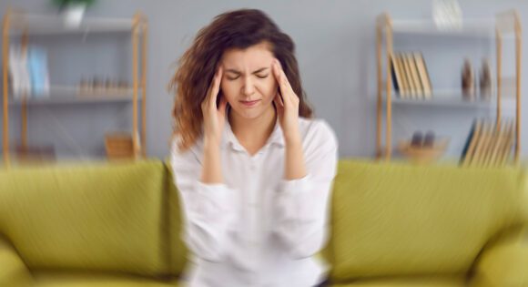 Woman Suffering from vertigo, dizziness, and pain