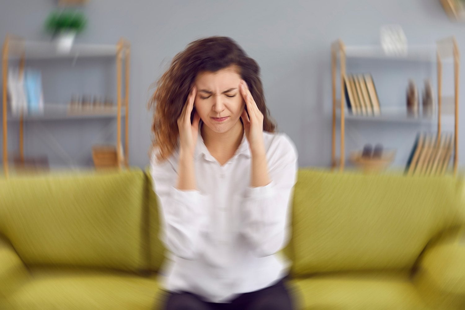 Woman Suffering from vertigo, dizziness, and pain