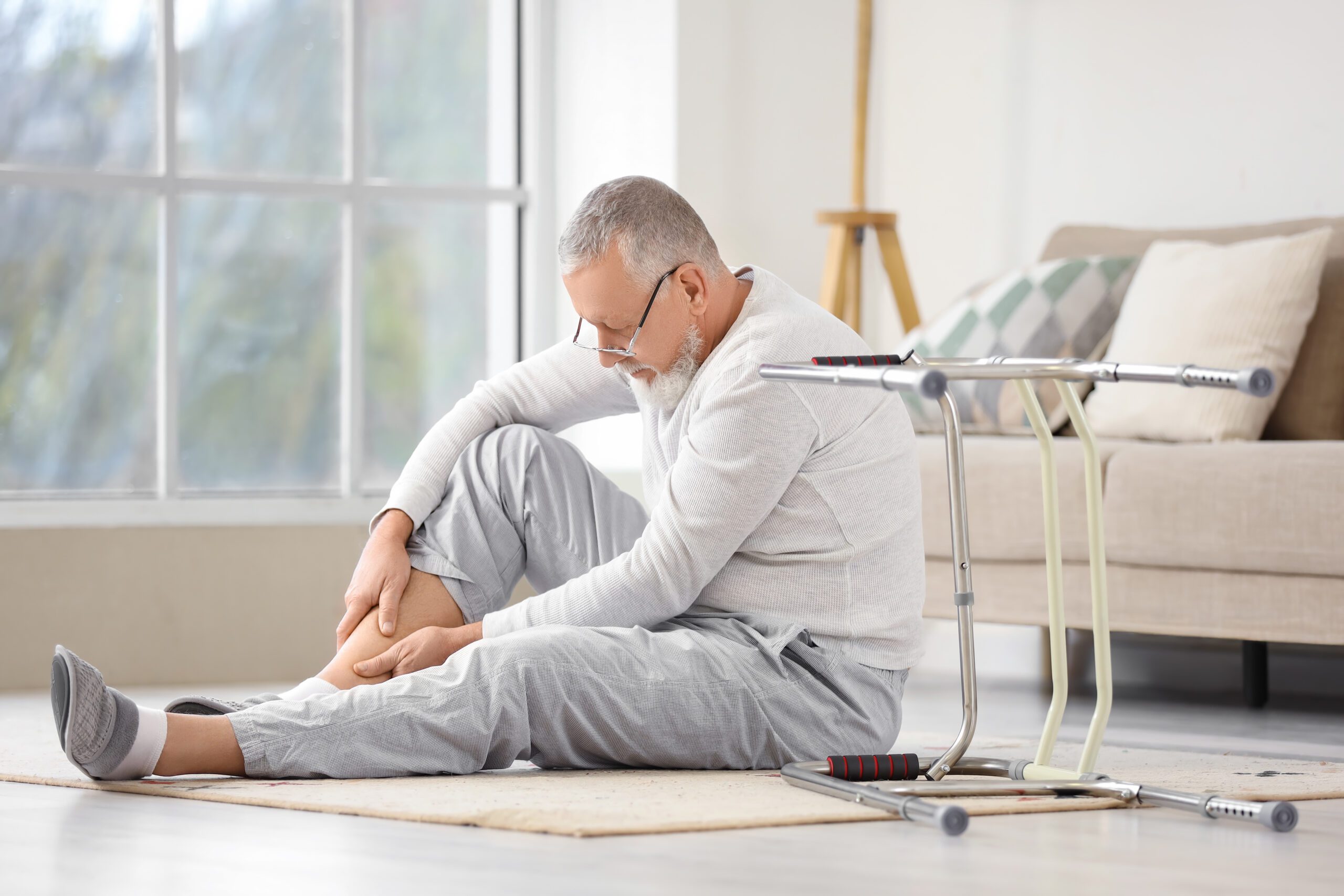 Senior man with injured leg
