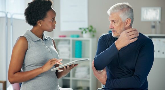Patient consulting with physical therapist