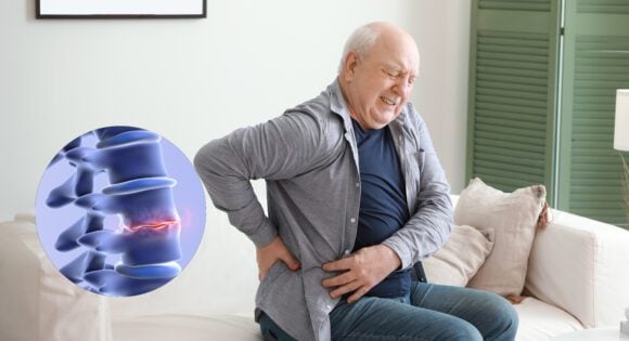 Middle aged man suffering from back pain